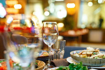 Served table set at restaraunt in the evening