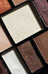 cosmetics, colored eye shadows close up isolated on white background