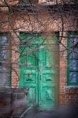 Fototapeta premium oldold wooden door in abandoned building