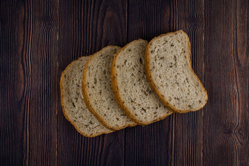 sliced bread on a dark wood table