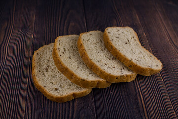 sliced bread on a dark wood table
