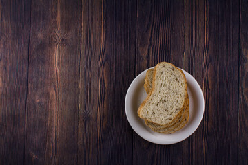 sliced bread on a dark wood table