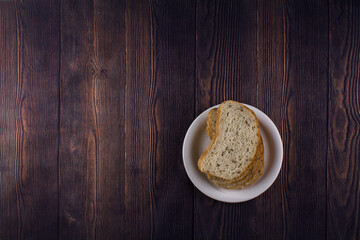 sliced bread on a dark wood table