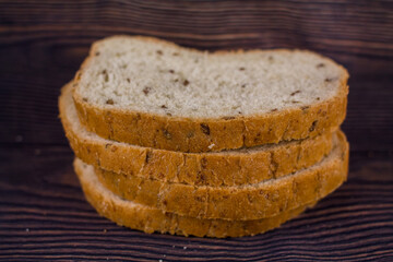 sliced bread on a dark wood table