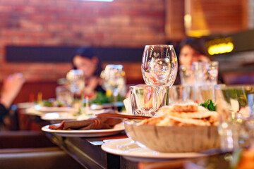 Served table set at restaraunt in the evening
