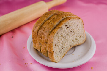 sliced bread with a rolling pin on the cloth
