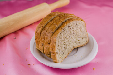 sliced bread with a rolling pin on the cloth