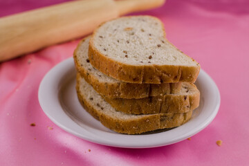 sliced bread with a rolling pin on the cloth