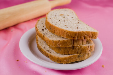 sliced bread with a rolling pin on the cloth