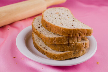 sliced bread with a rolling pin on the cloth