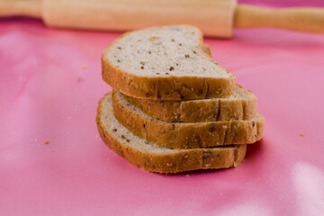 sliced bread with a rolling pin on the cloth