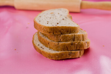 sliced bread with a rolling pin on the cloth