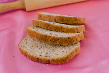 sliced bread with a rolling pin on the cloth