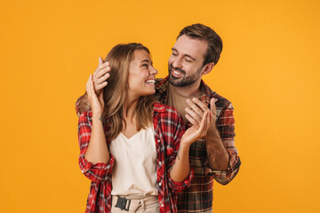 Beautiful happy couple smiling while making fun together