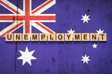 Unemployment. The inscription on wooden blocks on the background of the Australian flag....