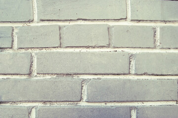 The texture of an old dirty white brick wall. Close-up.