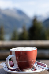 A cup of cappuccino drink before exploring the beautiful natural moutain of austria, durlsaboden