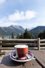 A cup of cappuccino drink before exploring the beautiful natural moutain of austria, durlsaboden