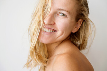 Woman with blond hair smiling portrait