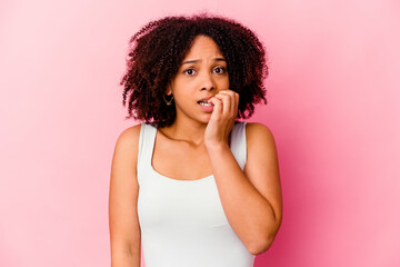 Young african american mixed race woman isolated biting fingernails, nervous and very anxious.