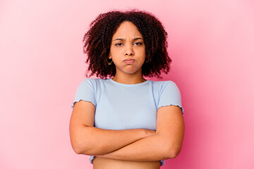 Young african american mixed race woman isolated blows cheeks, has tired expression. Facial expression concept.