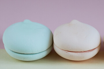 Bright and beautiful multi-colored desserts on pastel backgrounds Macaroons. Marshmallows. delicious breakfast. Beautiful healthy food. Background. Atelier