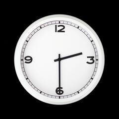 White round analog wall clock isolated on black background.