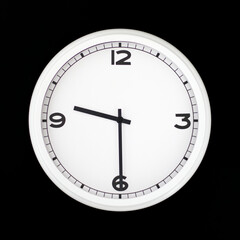 White round analog wall clock isolated on black background.
