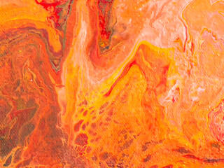Beautiful abstract background. Pouring acrylic paint on canvas.