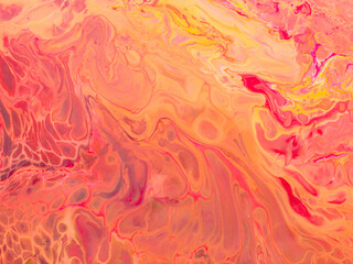 Beautiful abstract background. Pouring acrylic paint on canvas.