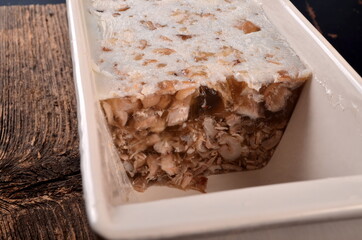 Meat jelly or meat aspic on plate. Homemade head cheese