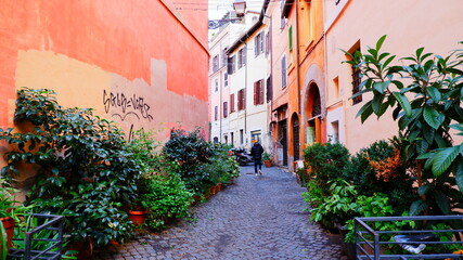 Cozy old street in Trastevere in Rome, Italy. Trastevere is rione of Rome, on the west bank of the Tiber in Rome, Lazio, Italy. Architecture and landmark of Rome