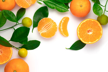 Tangerines or clementines with leaves on white background. Top view.