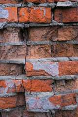 Close-up brick wall, broken red brick background, selective focus