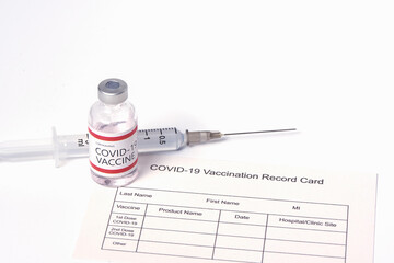 Coronavirus vaccine, syringe and needle on white background.