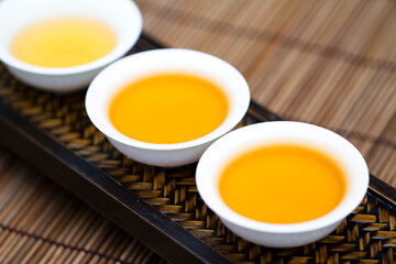 Three cups of Chinese Oolong tea, close-up