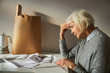 Female pensioner suffering from a bad headache