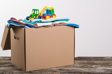 Donation box with children's things and toys. Donation box full with stuff for donate. Help poor.
