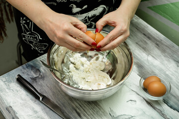 Making dough by female hands at home
