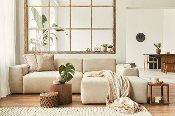 Modern interior of open space with design modular sofa, furniture, wooden coffee tables, plaid,...
