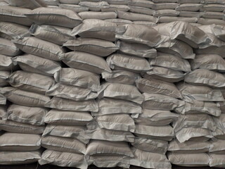 Chemical fertilizer The product stock is packed in sacks, stacked in the warehouse, waiting for delivery.	