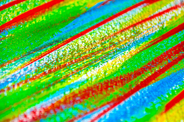 Many different multi-colored lines are chaotically drawn with brush