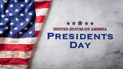 Fototapeta na wymiar Happy presidents day concept with flag of the United States on old stone background.