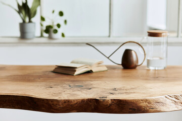 Stylish and cozy compositon of craft oak wooden table with chairs, watering can, glassy jug and...