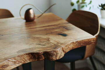 Stylish compositon of craft oak wooden table with chairs, copper watering can and modern floor in...