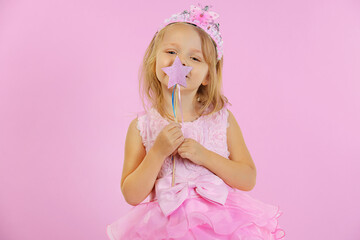 cute girl dressed up as a princess with a star magic wand © Igor