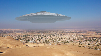 Alien Spaceship ufo Flying over city in the desert - aerial view
, drone view over Jericho city in Palestine with visual effect element, invasion sci fi concept
