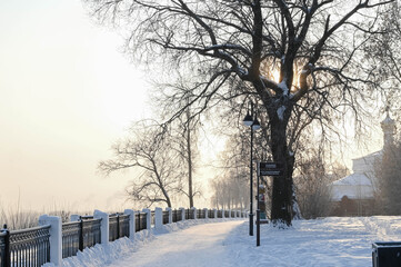 The embankment of Kirov in Russia on a sunny frosty winter day. Vyatka river. Scenic view....