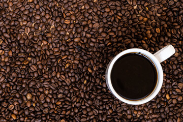 coffee mug with drink and grains beans seed roasted