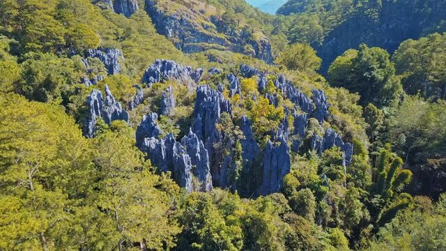 Rocky Cliffs With Lush Green Trees In Forest In Sagada - Sugong Hanging Coffins In Philippines. - aerial